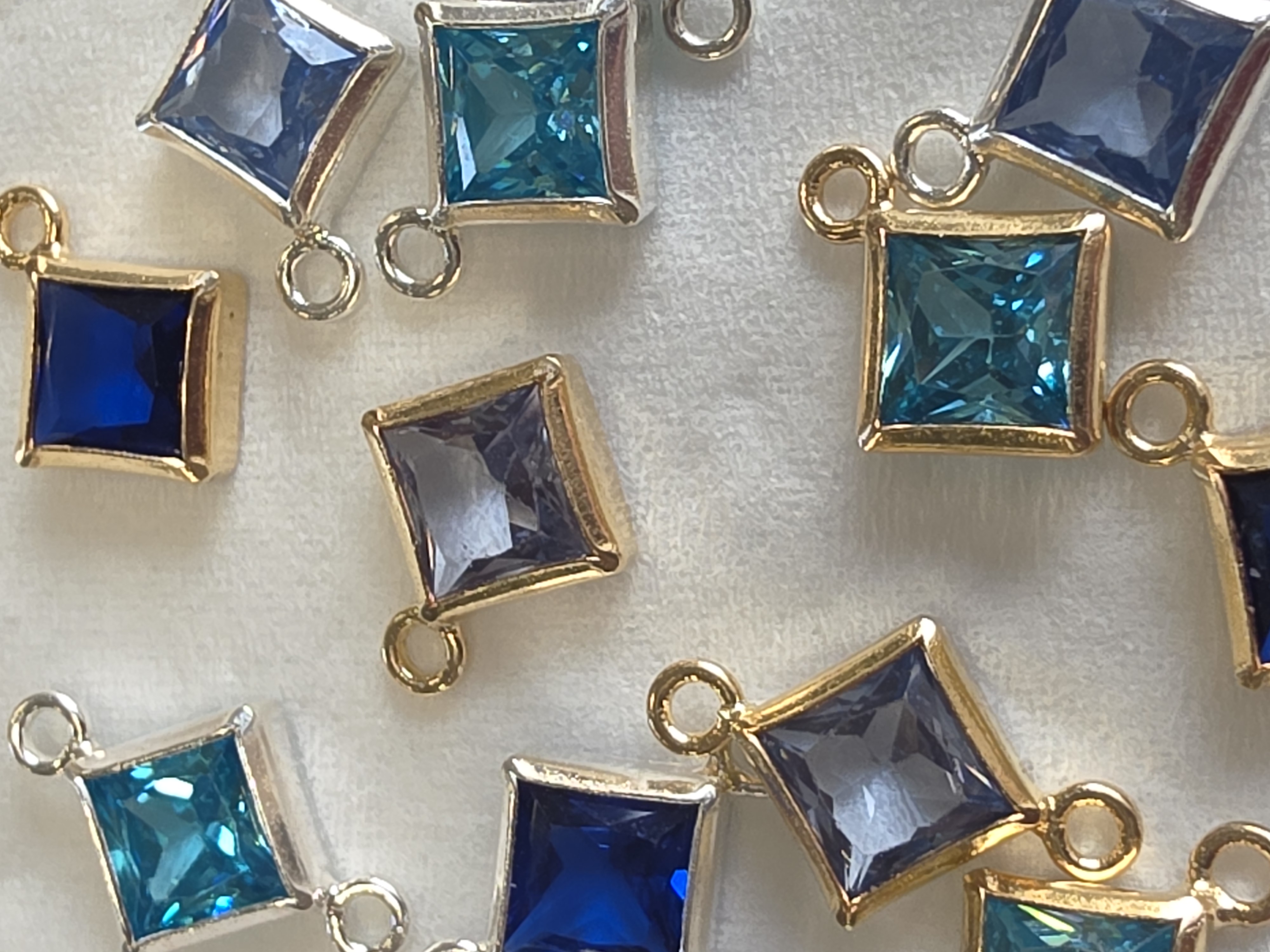 Permanent jewellery - piece, blue charms up close photo